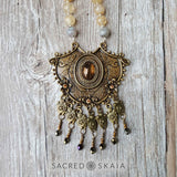 Closeup of pendant. Citrine, pyrite and labradorite are the abundance manifesting crystals also used in the Abundant Success Mala from Sacred Skaia.