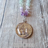 Back of silver moon fairy pendant. Crystals for anxiety included in the Emotional Freedom Mala by Sacred Skaia are amethyst, fluorite, clear quartz and labradorite or sandalwood. Also for use with EFT healing.