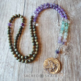 Crystals for anxiety included in the Emotional Freedom Mala by Sacred Skaia are amethyst, fluorite, clear quartz and labradorite or sandalwood. Also for use with EFT healing.