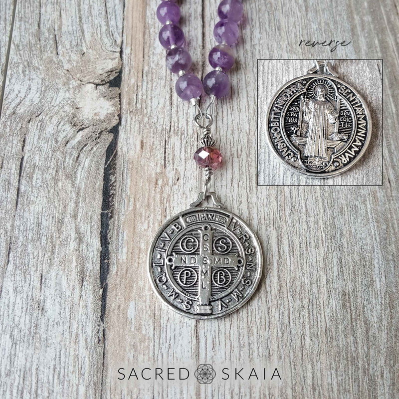 Double-sided silver pendant is a replica of St. Benedict's medal. Crystals for addiction included in the Addiction Recovery Mala are amethyst, lepidolite, smoky quartz, black obsidian, hematite and rosewood.