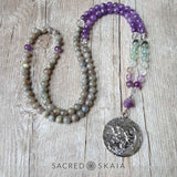 Crystals for anxiety included in the Emotional Freedom Mala by Sacred Skaia are amethyst, fluorite, clear quartz and labradorite or sandalwood. Also for use with EFT healing.