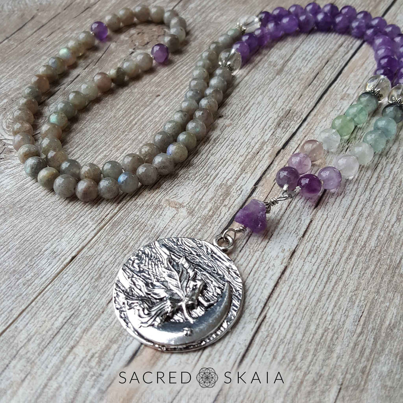 Crystals for anxiety included in the Emotional Freedom Mala by Sacred Skaia are amethyst, fluorite, clear quartz and labradorite or sandalwood. Also for use with EFT healing.
