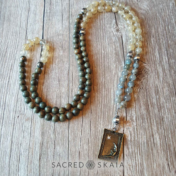 Crystals for abundance included in the Magical Abundance Mala by Sacred Skaia are citrine, labradorite, pyrite and sandalwood.
